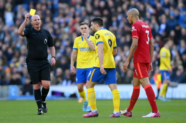 Neal Maupay shown yellow card by Mike Dean