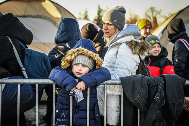 People at the Medyka border cross from Ukraine to Poland