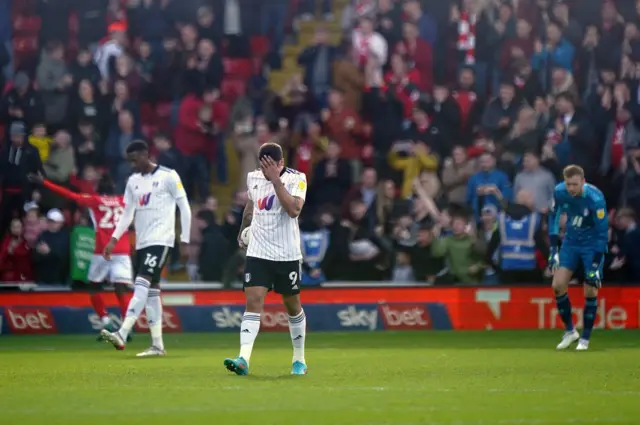 Fulham players look dejected after conceding at Barnsley