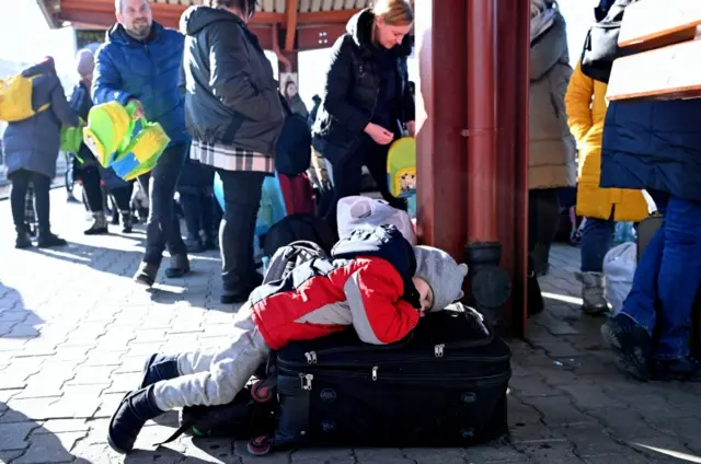 Refugees arrive at the train station in Przemysl, southeastern Poland