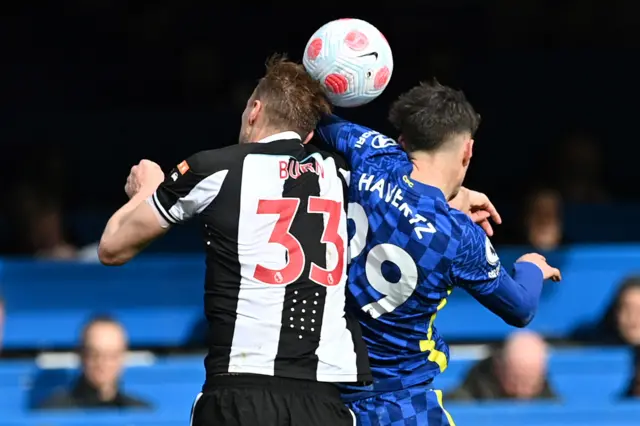 Kai Havertz leads with his elbow in an aerial challenge with Dan Burn