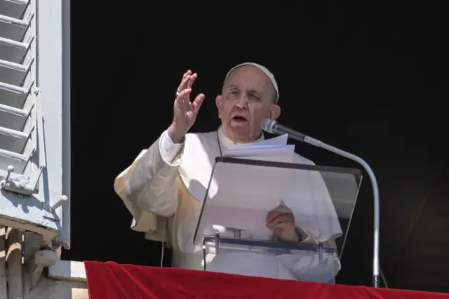 Pope Francis speaks from the window of the apostolic palace during the weekly Angelus prayer on March 13, 2022