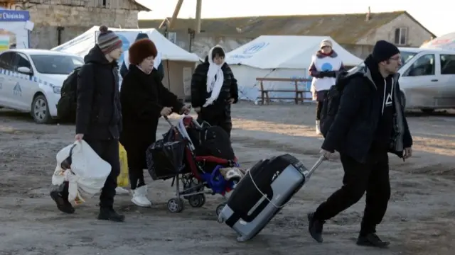 Refugees with luggage