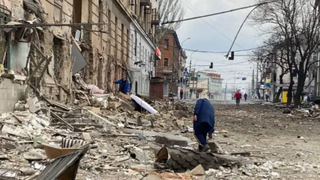 Shell-damaged street in Mariupol (undated)