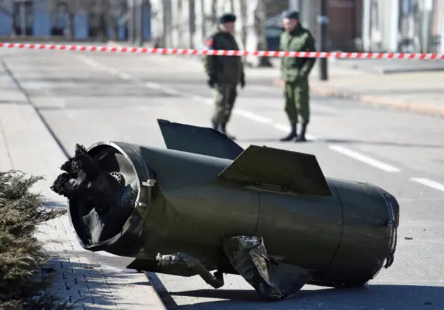 A fragment of a missile is seen in the street after shelling in the separatist-controlled city of Donetsk