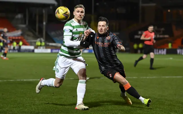 Dundee United's Marc McNulty (right) and Celtic's Carl Starfelt