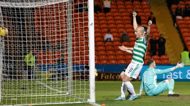 Daizen Maeda celebrates Callum McGregor's (hidden) opening goal for Celtic