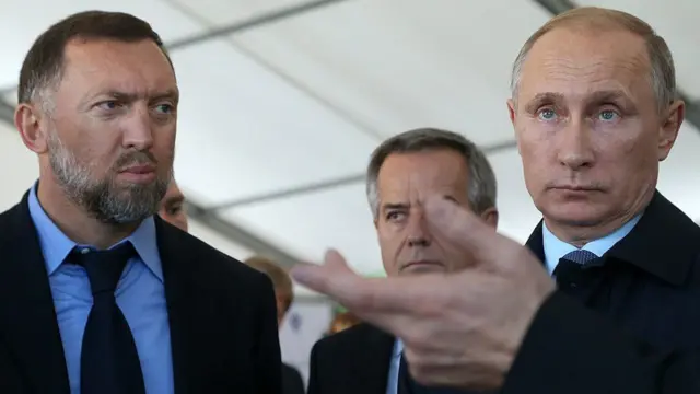 Mr Deripaska (left) pictured with President Putin in 2014