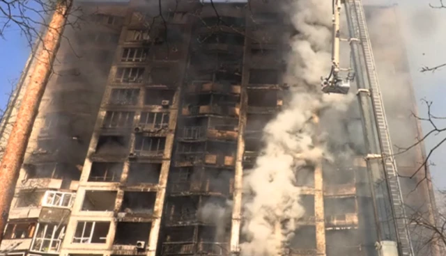 A badly damaged residential building in Kyiv