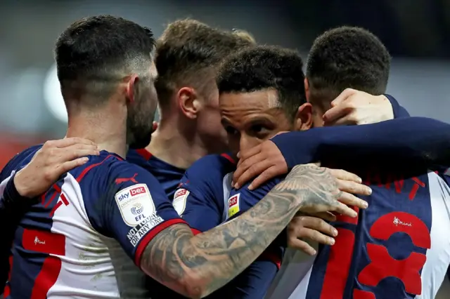 West Brom players celebrate Callum Robinson's winner against Fulham