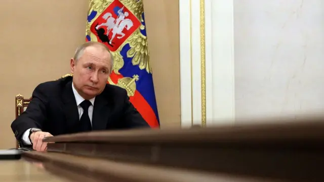 Russian President Vladimir Putin attends a meeting with government members via a video link in Moscow