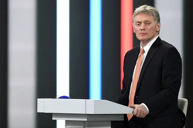 Dmitry Peskov holding a news conference