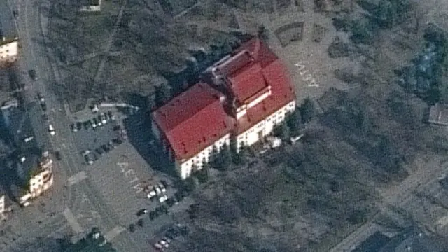 An aerial picture of the theatre with the world children written in Russia at the front and back