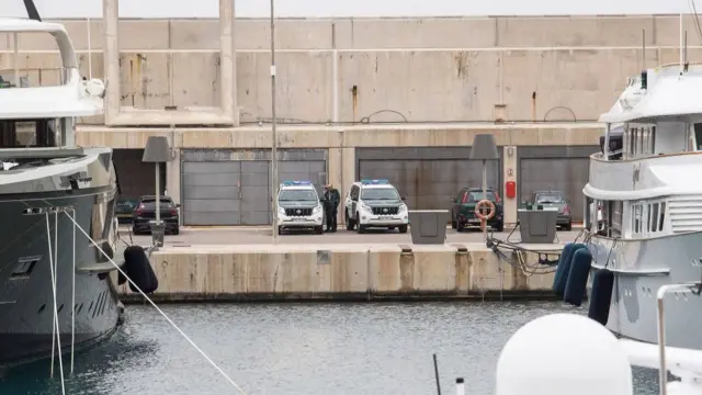 Spanish police guard a yacht seized in Mallorca