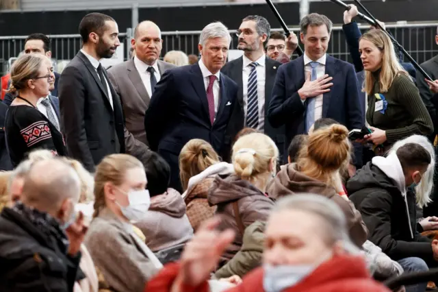 King Phillippe (centre) meeting refuees