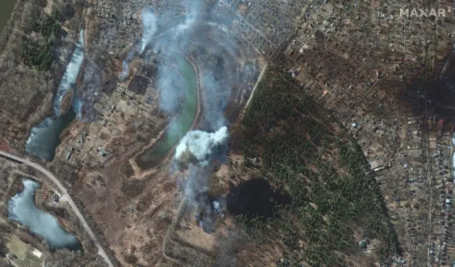 A Russian artillery strike makes impact on a burning field in south Chernihiv, in northern Ukraine