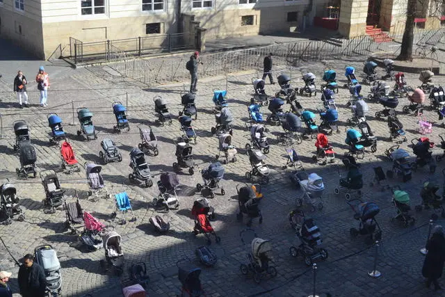 Strollers in Lviv symbolising children killed in the war