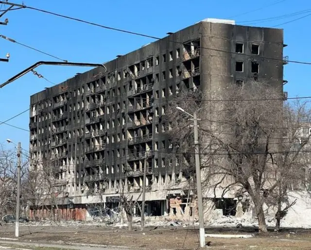 A bombed apartment building in Mariupol