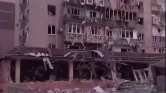 A destroyed apartment block in Mariupol