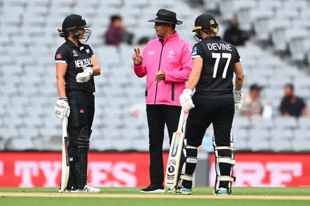 Umpire speaks to batters