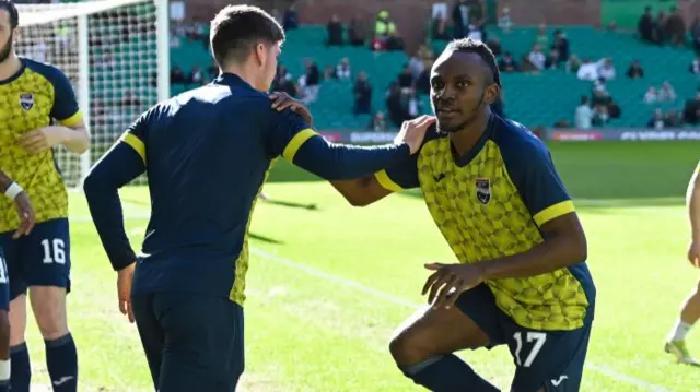 Ross County winger Regan Charles-Cook warms up