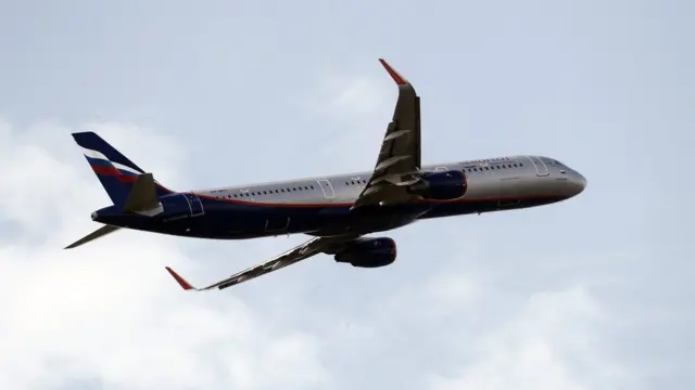 An aircraft with the Russian flag on the tail