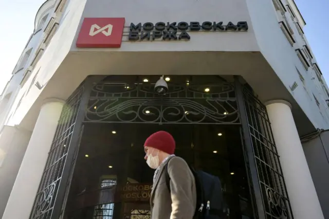 A man walks past the Moscow's stock market building.