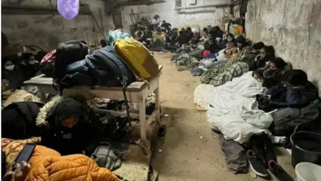 Students in an apartment bunker in Kharkiv