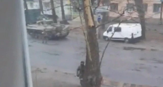 A tank on soldiers on the streets of Kherson, southern Ukraine