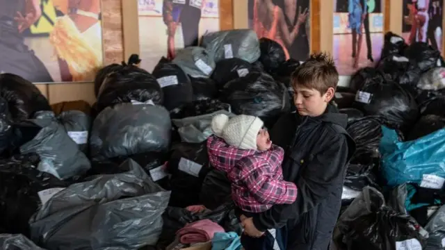 Two children at humanitarian aid point in Lviv, Ukraine