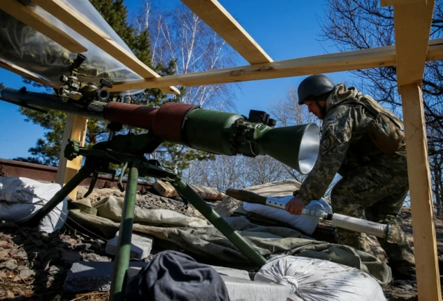 A Ukrainian service member on the front line in the east Kyiv region