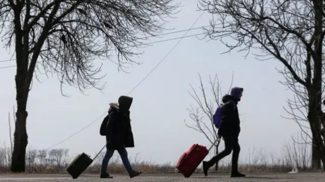 Refugees leave the city of Mariupol