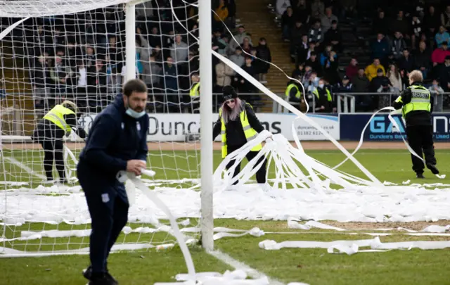 Stewards attempt to remove toilet roll at Dens Park