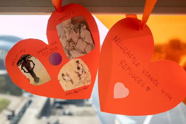 Messages of support written on orange hearts