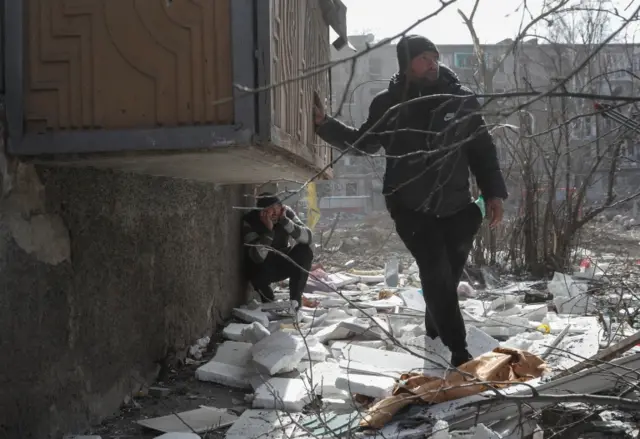 Mariupol residents take cover