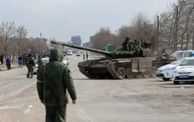 Service members of pro-Russian troops in the besieged city of Mariupol 20 March 2022