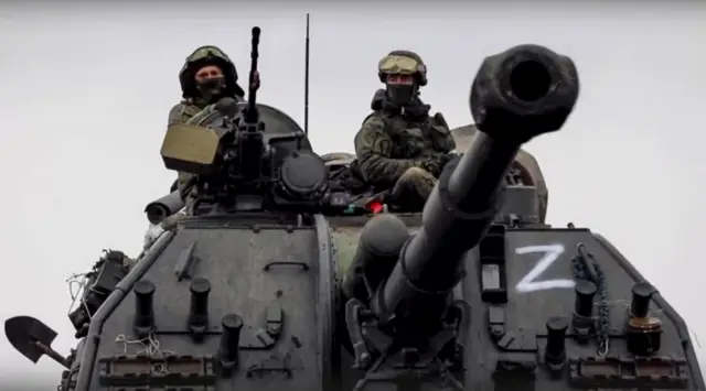 Russian servicemen on military vehicle near Kyiv