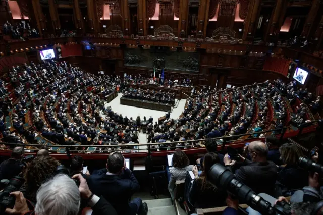 Ukrainian President Volodymyr Zelensky (on screen) addresses members of the Italian parliament via video conference during an extraordinary plenary session in Rome, Italy, on 22 March 2022