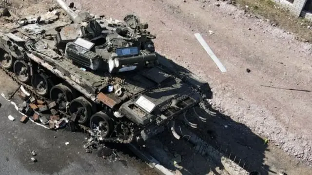 A charred Russian tank is seen on the front line in the Kyiv region, Ukraine March 20, 2022