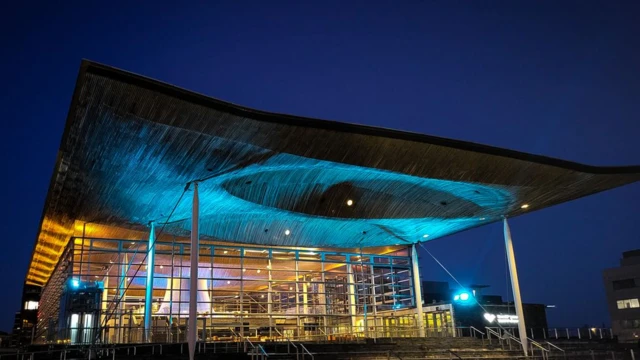 The Senedd lit in the blue and yellow colours of Ukraine’s flag