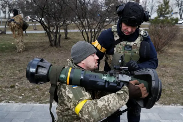 An instructor shows a new member of the Territorial Defence Forces how to operate an NLAW anti-tank launcher during military exercises amid Russia's invasion of Ukraine, in Kyiv, Ukraine, 9 March 2022