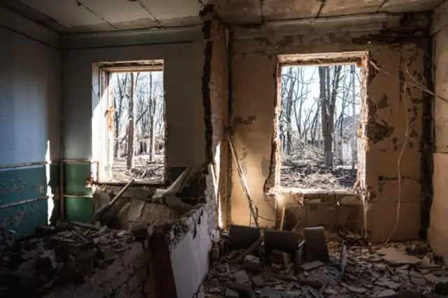 A damaged residential building in Kharkiv