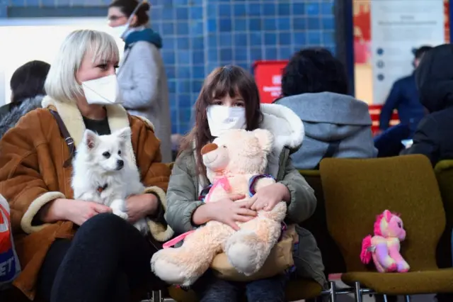 Refugees fleeing Russia's invasion of Ukraine wait in the station hall, on their way to Leipzig, at the central station in Goerlitz, Germany