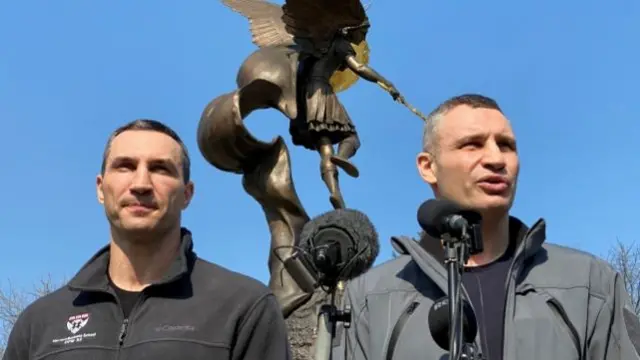 Kyiv Mayor Vitali Klitschko speaking to journalists alongside his brother Wladimir