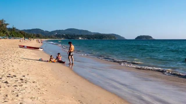 People on the beach in Thailand