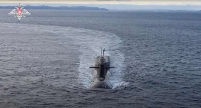 A Russian nuclear submarine sails in an unknown location