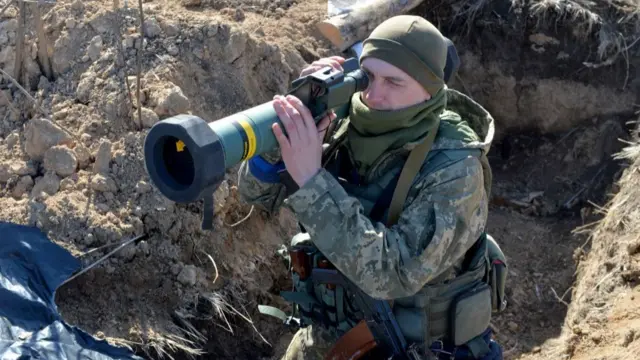 A Ukrainian soldier holds a US-based Javelin missile launcher outside Kharkiv