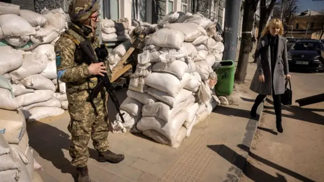 A Ukrainian soldier mans a checkpoint in the northern city of Zhytomyr