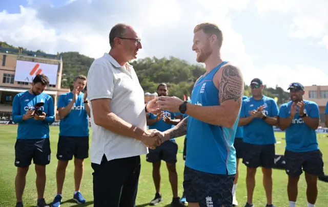 Ben Stokes gives Jonathan Agnew a pin badge