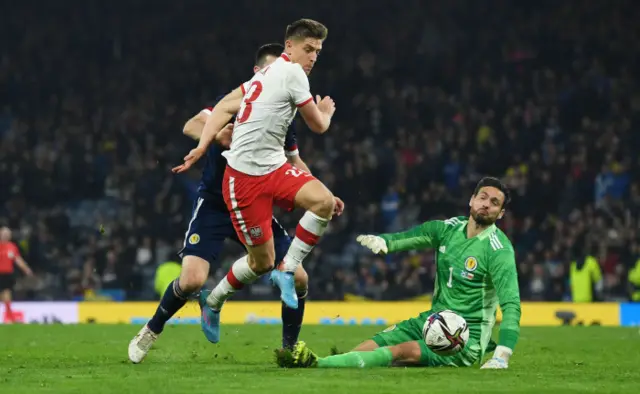 Krzysztof Piatek goes down to win Poland a stoppage-time penalty